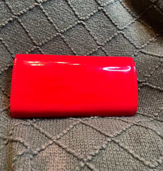 "HANDS ON CLUTCH", BRIGHT RED (Brooch sold separately)