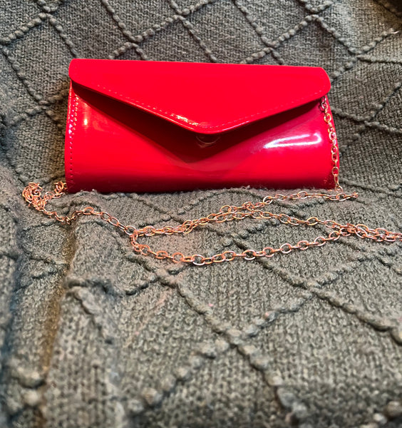 "HANDS ON CLUTCH", BRIGHT RED (Brooch sold separately)